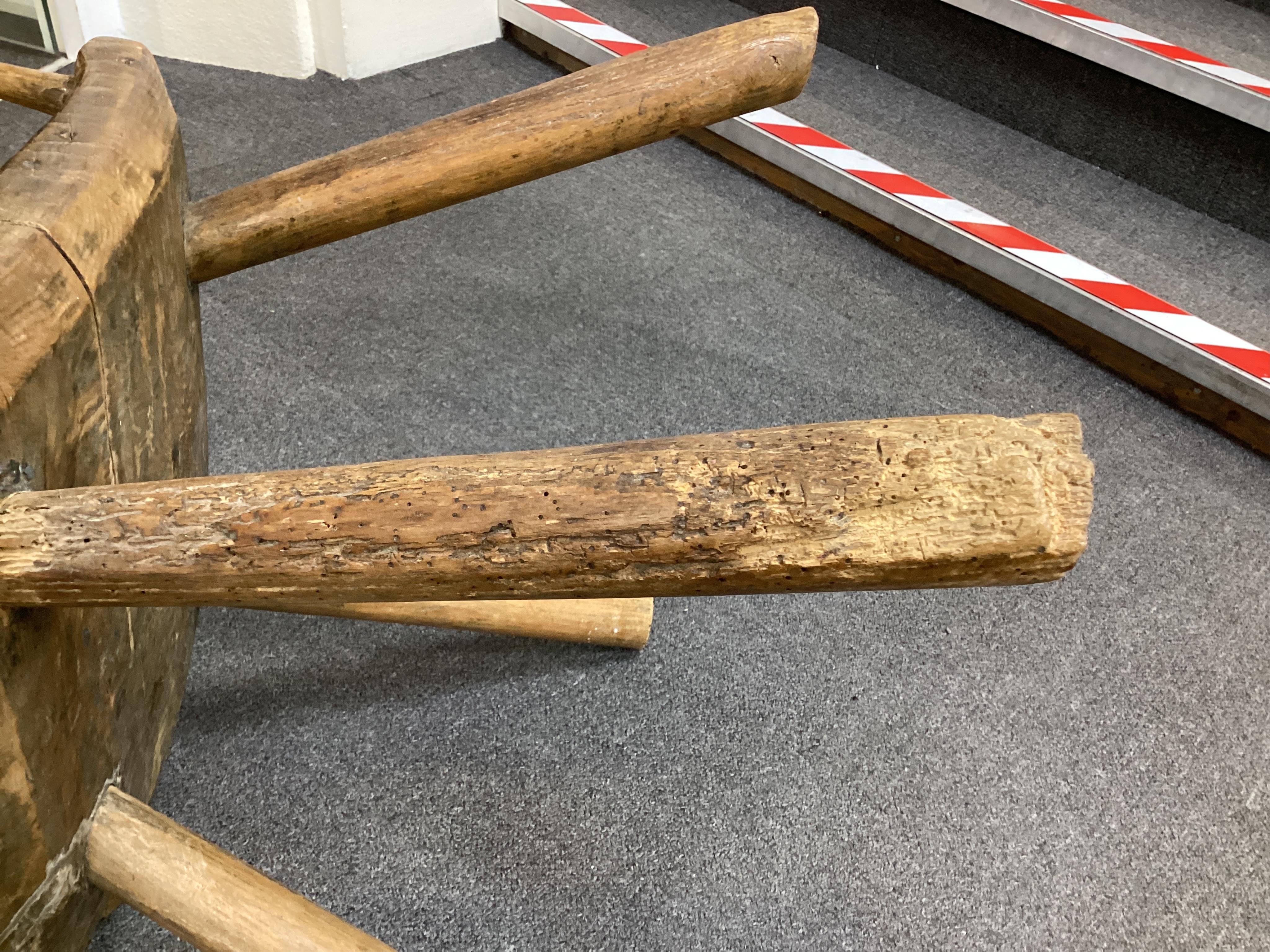 An 18th or 19th century primitive ash and elm Windsor armchair